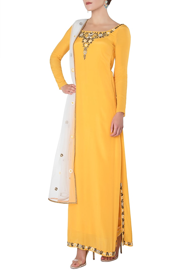 Turmeric yellow embroidered kurta with salwar pants set available only at Pernia's Pop Up Shop.