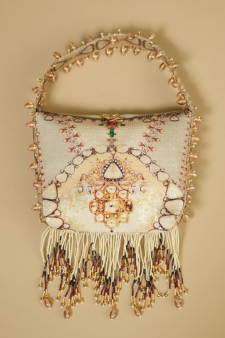 Cream Cotton Sequin & Tasseled Potli Bag by The Garnish Company at Pernia's Pop Up Shop