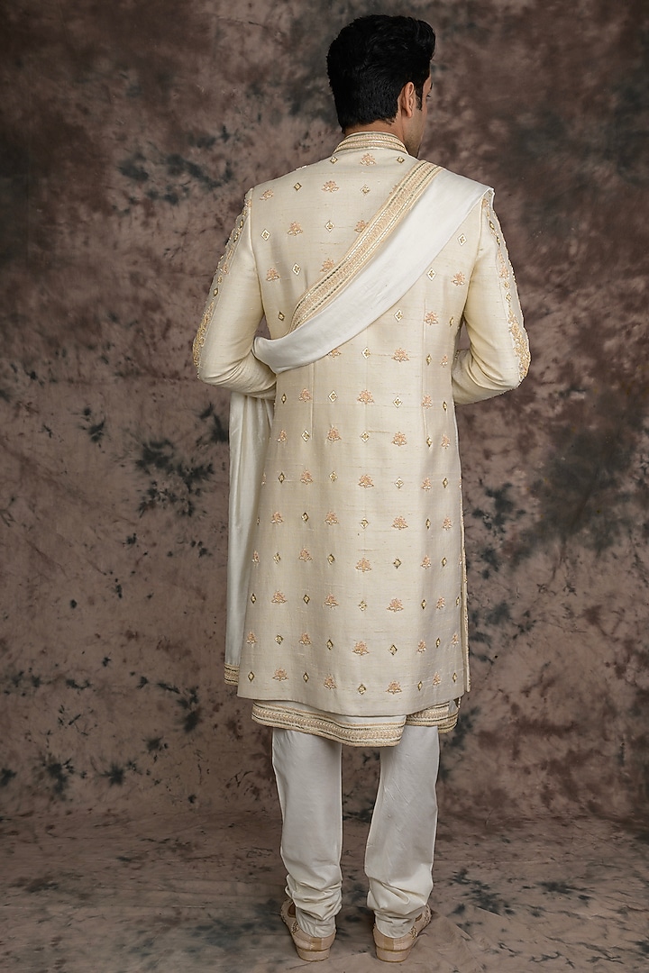 Ivory Raw Silk Embroidered Groom Sherwani Set by THE BLUES at Pernia's Pop Up Shop