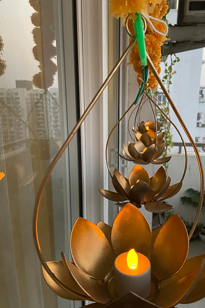 Gold Iron Hanging Tealight Candles (Set of 2) by The house of trendz at Pernia's Pop Up Shop