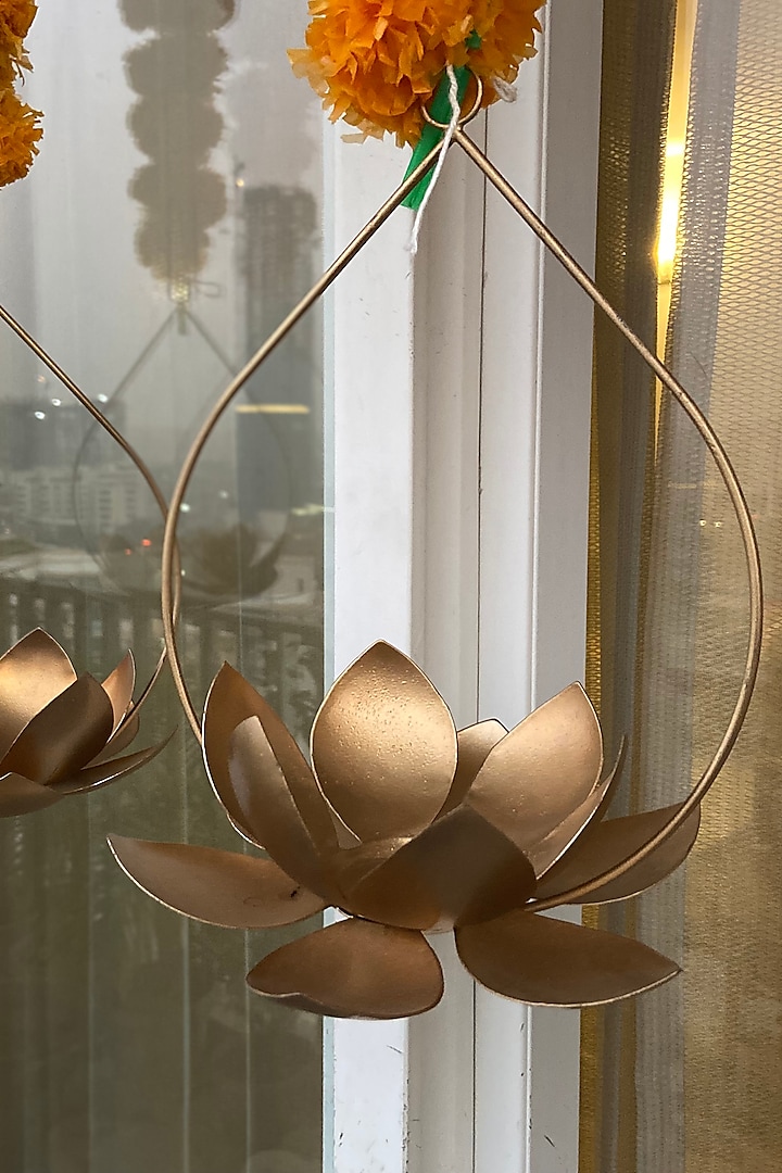 Gold Iron Hanging Tealight Candles (Set of 2) by The house of trendz at Pernia's Pop Up Shop
