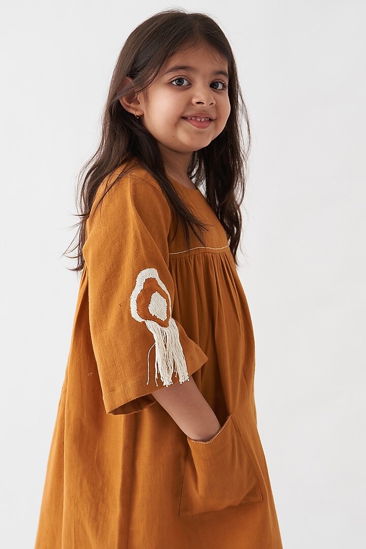 Rust Handwoven Cotton Dress For Girls by Three Kidswear at Pernia's Pop Up Shop