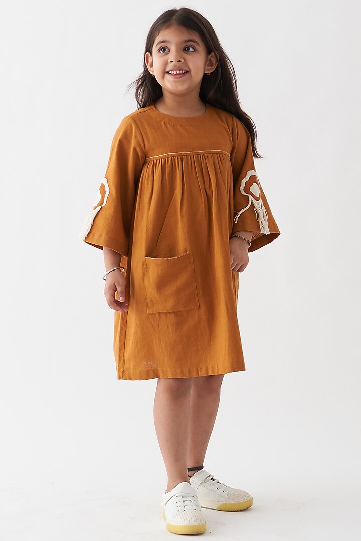 Rust Handwoven Cotton Dress For Girls by Three Kidswear at Pernia's Pop Up Shop