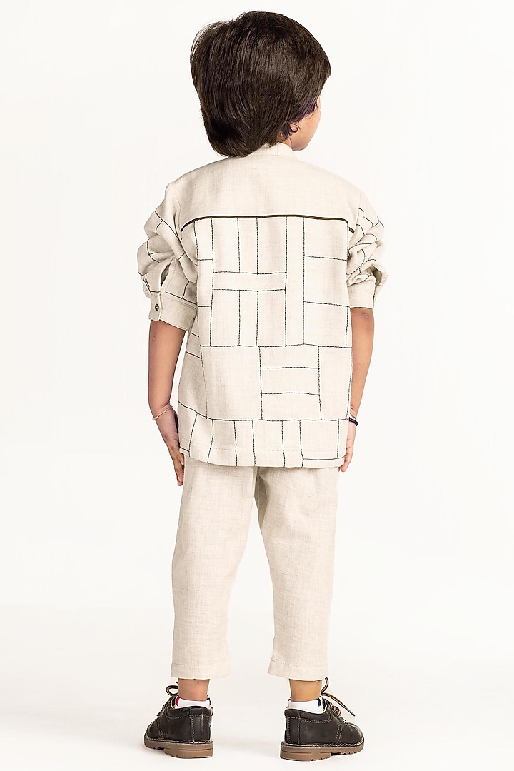 Ivory Striped Pants For Boys by Three Kidswear at Pernia's Pop Up Shop