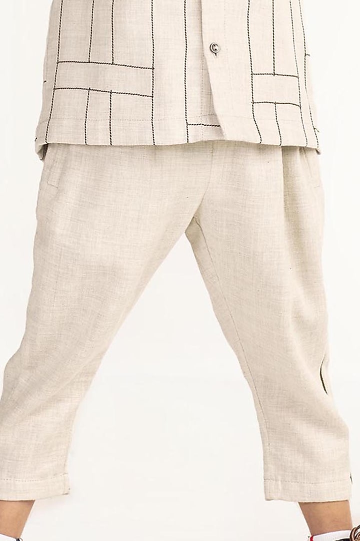 Ivory Striped Pants For Boys by Three Kidswear at Pernia's Pop Up Shop
