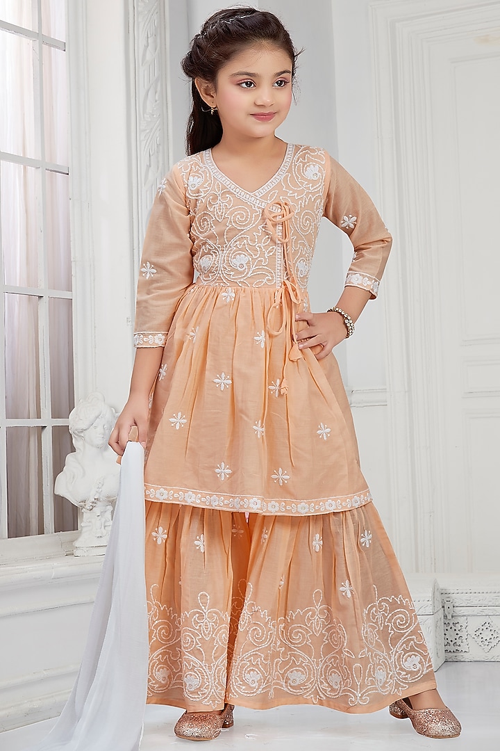 Peach Cotton Mulmul Thread Embroidered Sharara Set For Girls by TIAARNA at Pernia's Pop Up Shop