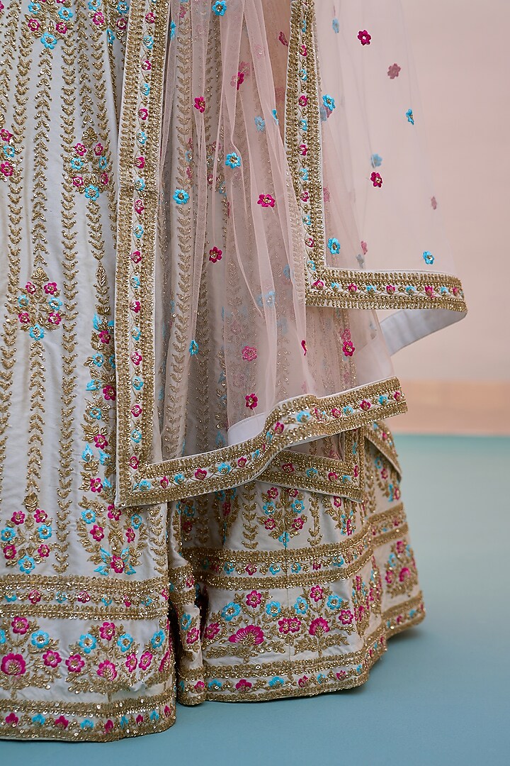 Ivory Raw Silk Applique Embroidered Wedding Lehenga Set by Angad Singh at Pernia's Pop Up Shop