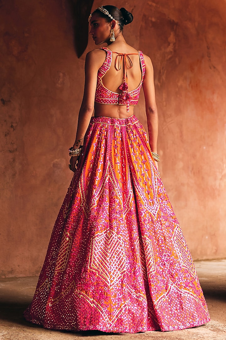 Rani Pink & Rust Raw Silk Mirror Embroidered Wedding Lehenga Set by Angad Singh at Pernia's Pop Up Shop