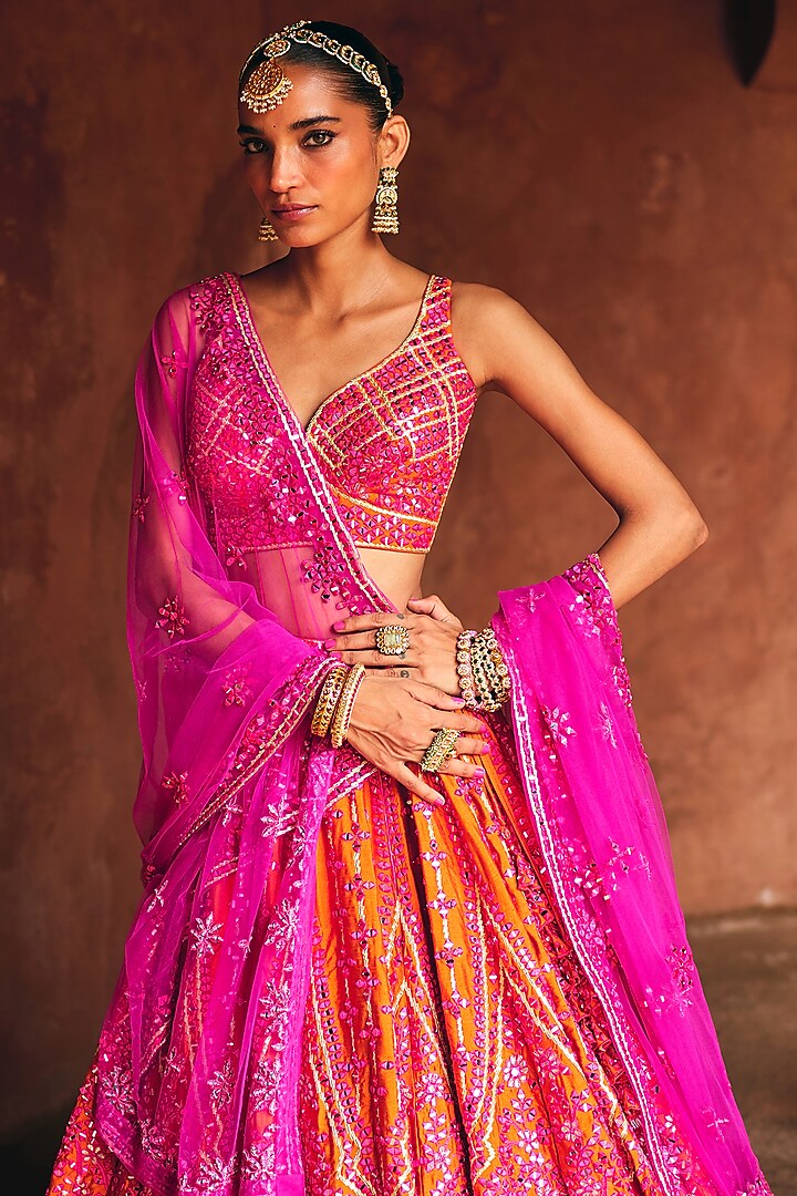 Rani Pink & Rust Raw Silk Mirror Embroidered Wedding Lehenga Set by Angad Singh at Pernia's Pop Up Shop