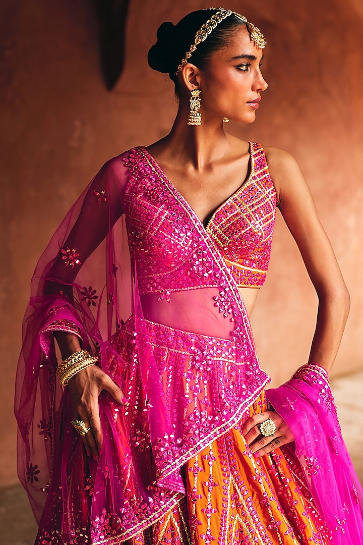 Rani Pink & Rust Raw Silk Mirror Embroidered Wedding Lehenga Set by Angad Singh at Pernia's Pop Up Shop