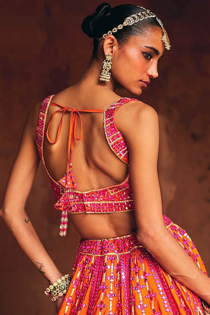Rani Pink & Rust Raw Silk Mirror Embroidered Wedding Lehenga Set by Angad Singh at Pernia's Pop Up Shop