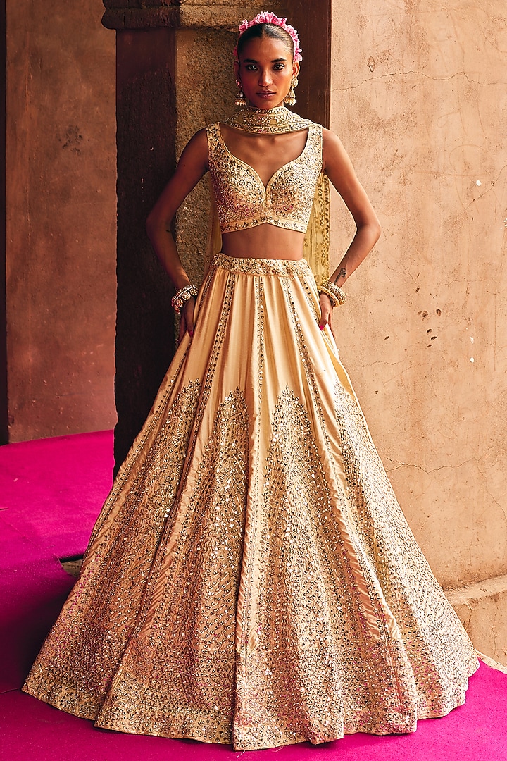 Champagne Gold Raw Silk Mirror Embroidered Wedding Lehenga Set by Angad Singh at Pernia's Pop Up Shop