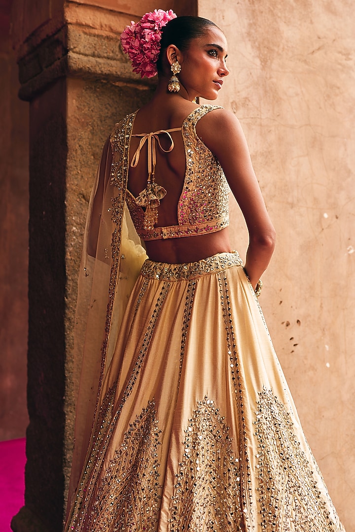 Champagne Gold Raw Silk Mirror Embroidered Wedding Lehenga Set by Angad Singh at Pernia's Pop Up Shop