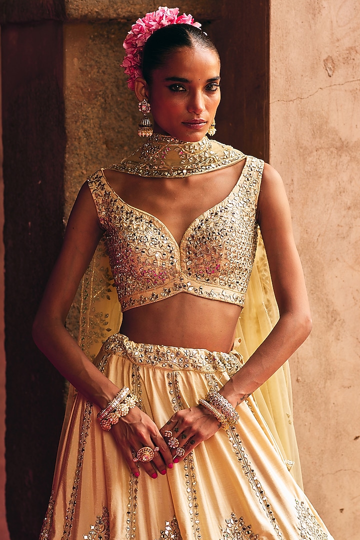 Champagne Gold Raw Silk Mirror Embroidered Wedding Lehenga Set by Angad Singh at Pernia's Pop Up Shop