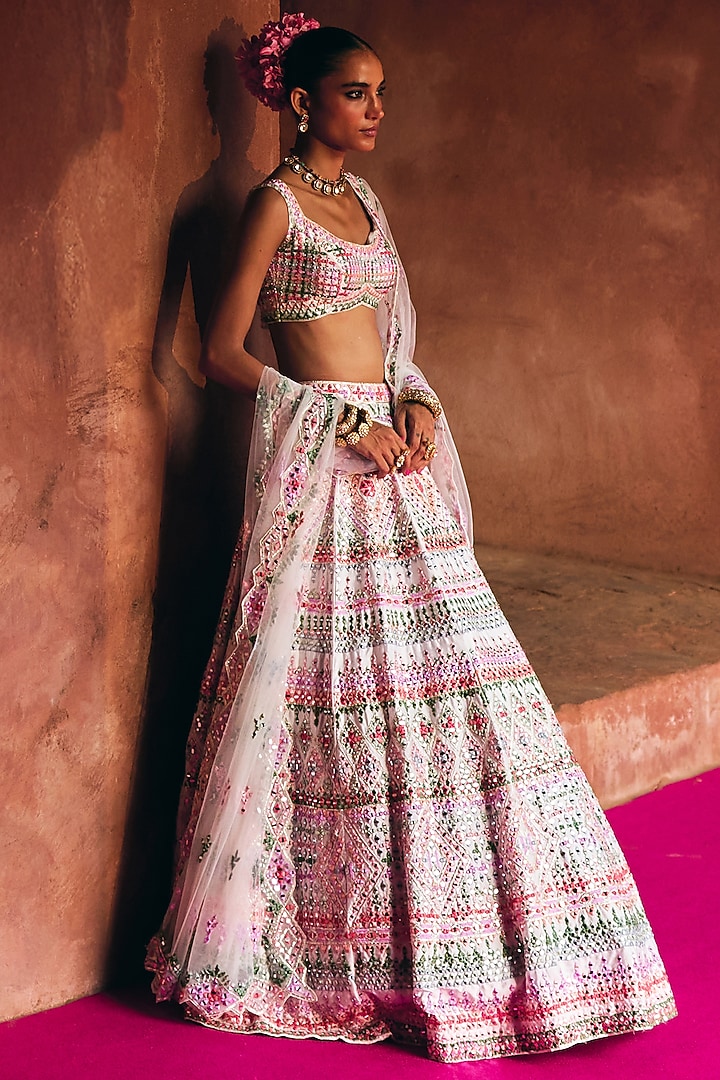 Ivory Raw Silk Mirror Embroidered Wedding Lehenga Set by Angad Singh at Pernia's Pop Up Shop