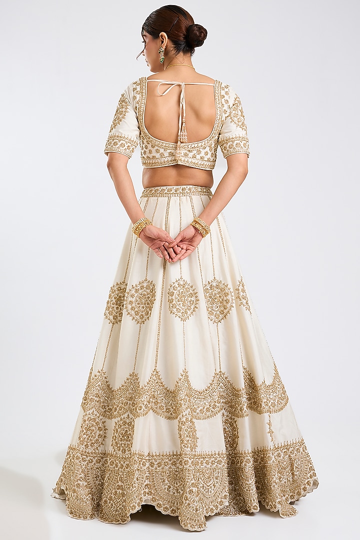 Ivory Raw Silk Embroidered Wedding Lehenga Set by Angad Singh at Pernia's Pop Up Shop