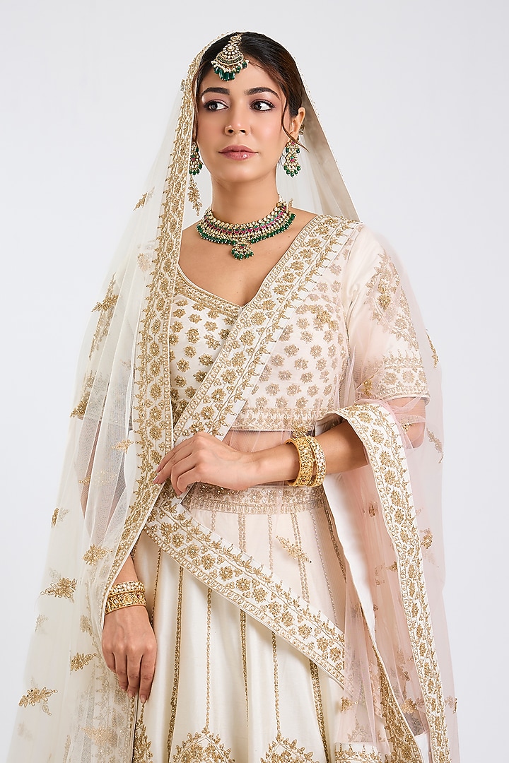 Ivory Raw Silk Embroidered Wedding Lehenga Set by Angad Singh at Pernia's Pop Up Shop