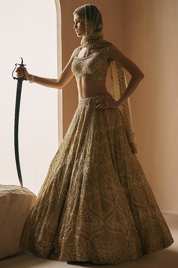 Champagne Gold Organza Sequins Embroidered Bridal Lehenga Set by Angad Singh at Pernia's Pop Up Shop