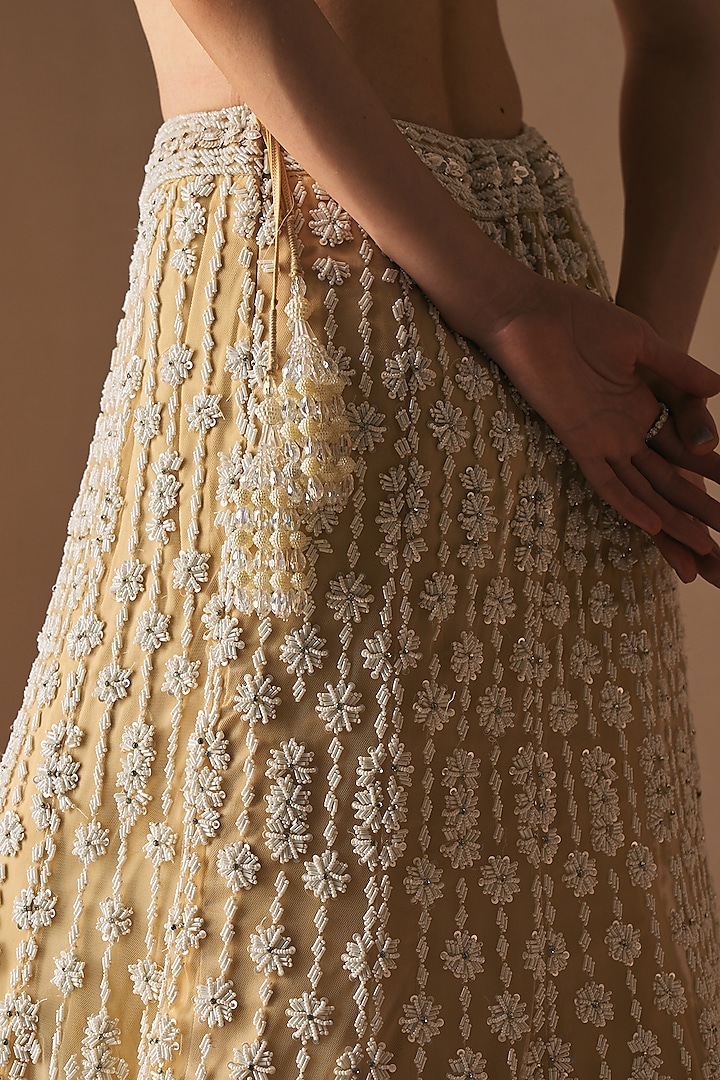Ivory Net Cutdana & Mirror Embroidered Mermaid Bridal Lehenga Set by Angad Singh at Pernia's Pop Up Shop