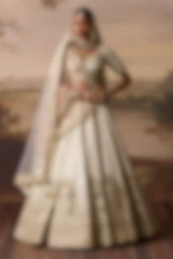 Ivory Raw Silk Nakshi Embroidered Bridal Lehenga Set by Angad Singh at Pernia's Pop Up Shop