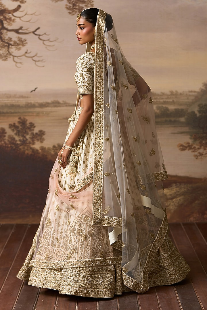 Ivory Raw Silk Nakshi Embroidered Bridal Lehenga Set by Angad Singh at Pernia's Pop Up Shop