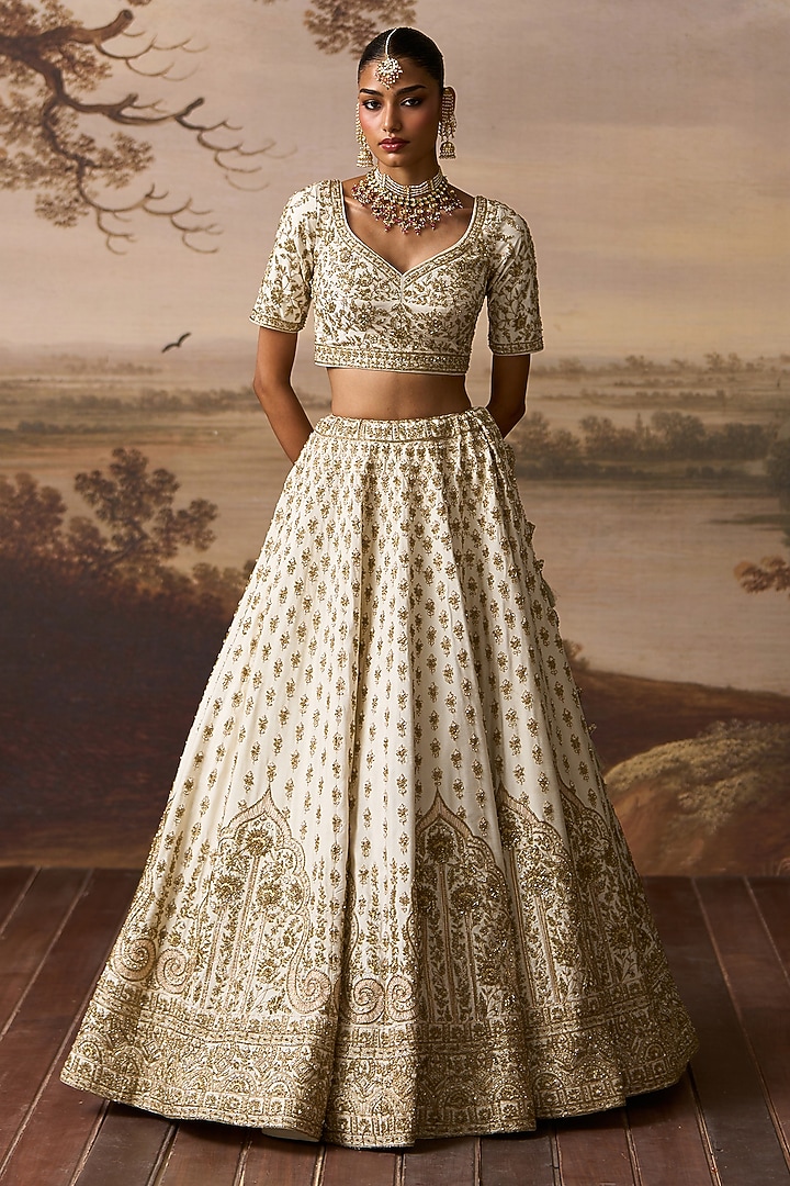 Ivory Raw Silk Nakshi Embroidered Bridal Lehenga Set by Angad Singh at Pernia's Pop Up Shop