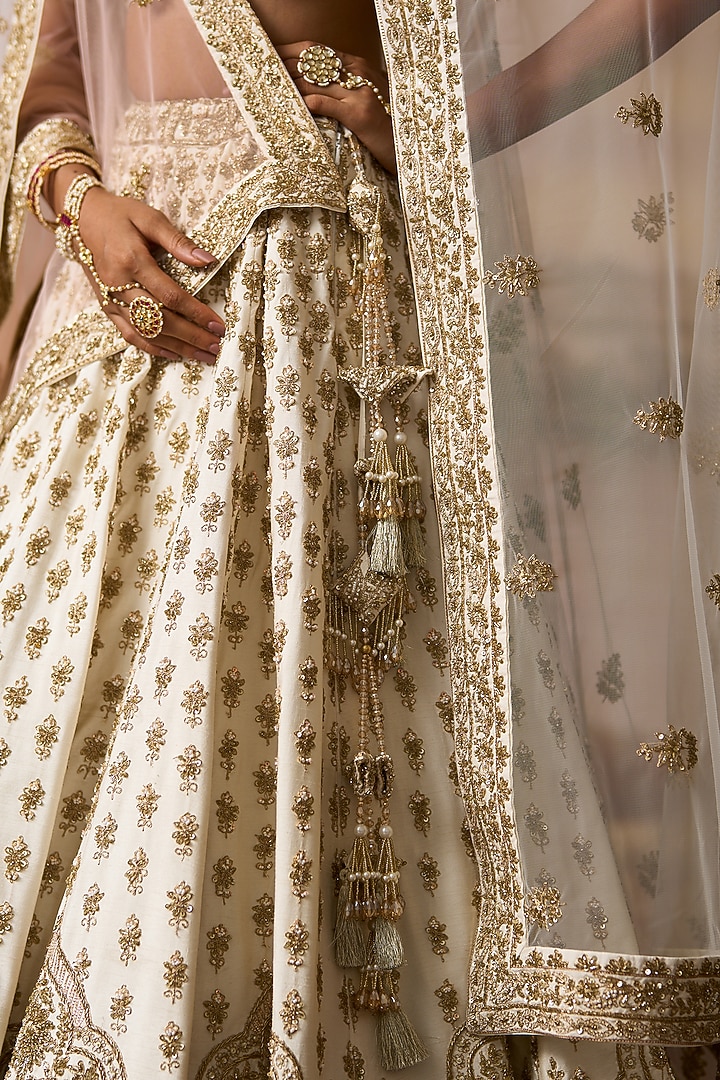 Ivory Raw Silk Nakshi Embroidered Bridal Lehenga Set by Angad Singh at Pernia's Pop Up Shop
