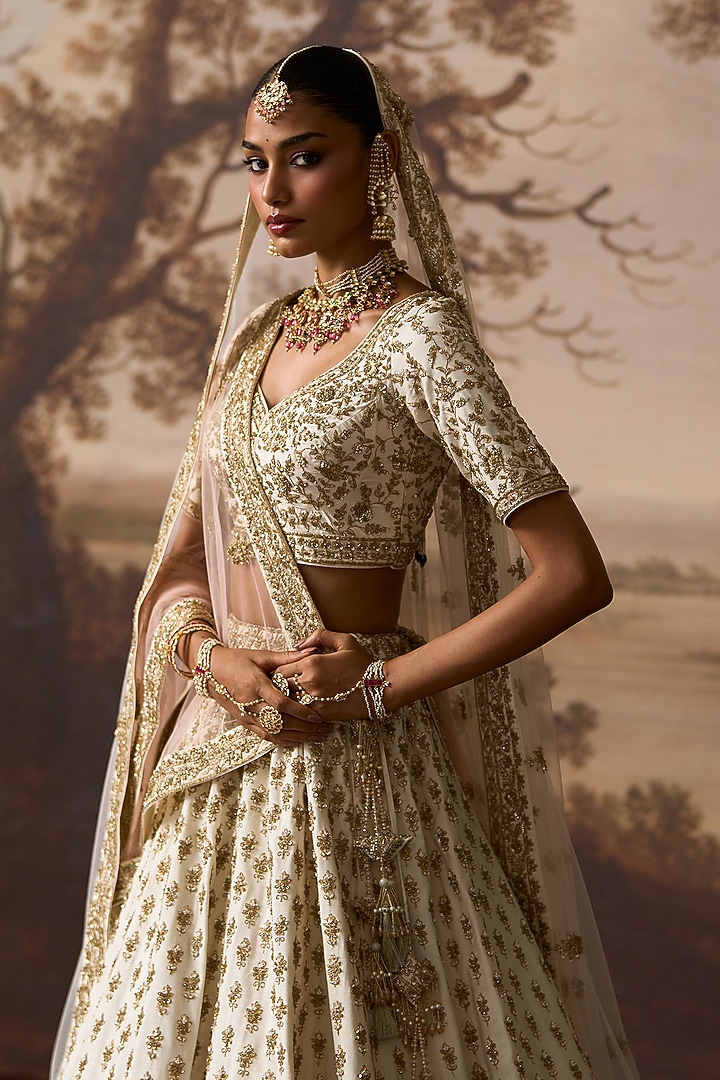 Ivory Raw Silk Nakshi Embroidered Bridal Lehenga Set by Angad Singh at Pernia's Pop Up Shop