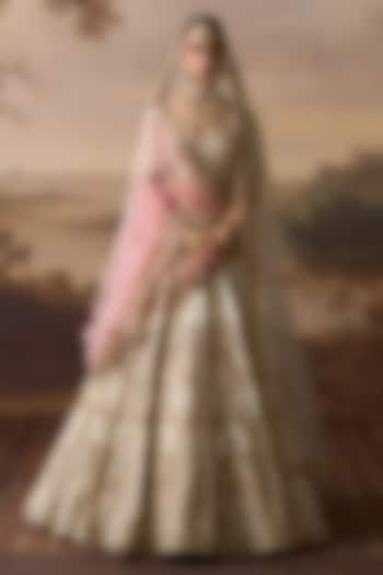 Ivory Raw Silk Floral Embroidered Bridal Lehenga Set by Angad Singh at Pernia's Pop Up Shop