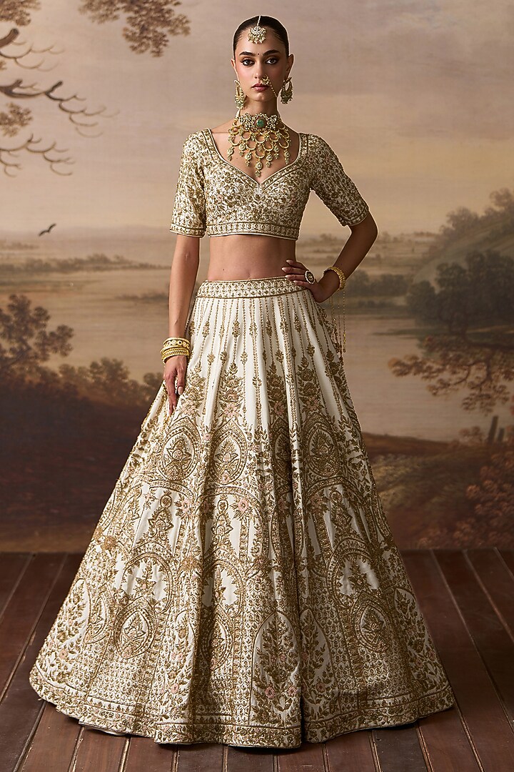 Ivory Raw Silk Floral Embroidered Bridal Lehenga Set by Angad Singh at Pernia's Pop Up Shop