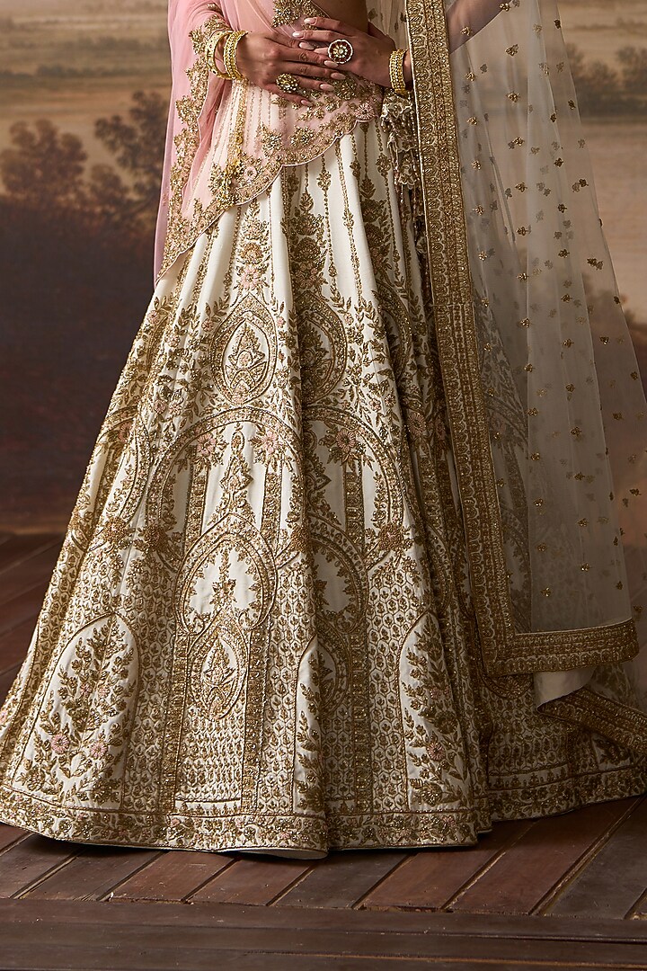 Ivory Raw Silk Floral Embroidered Bridal Lehenga Set by Angad Singh at Pernia's Pop Up Shop