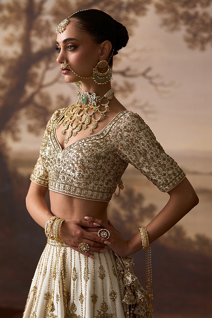 Ivory Raw Silk Floral Embroidered Bridal Lehenga Set by Angad Singh at Pernia's Pop Up Shop