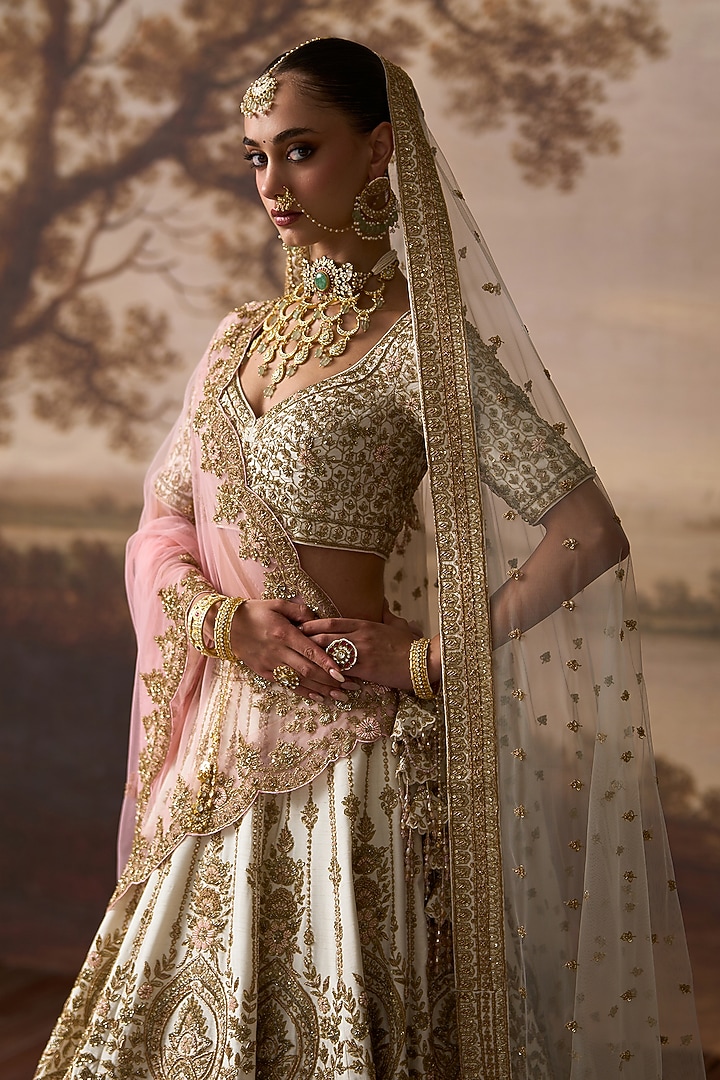 Ivory Raw Silk Floral Embroidered Bridal Lehenga Set by Angad Singh at Pernia's Pop Up Shop