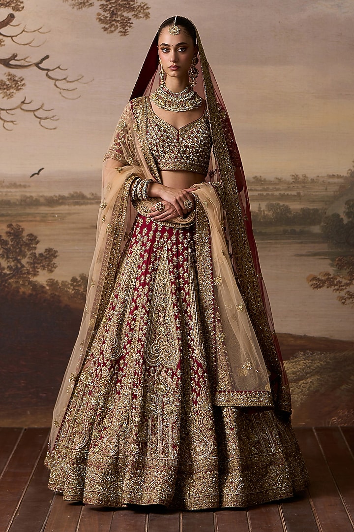 Maroon Raw Silk Motif Embroidered Bridal Lehenga Set by Angad Singh at Pernia's Pop Up Shop