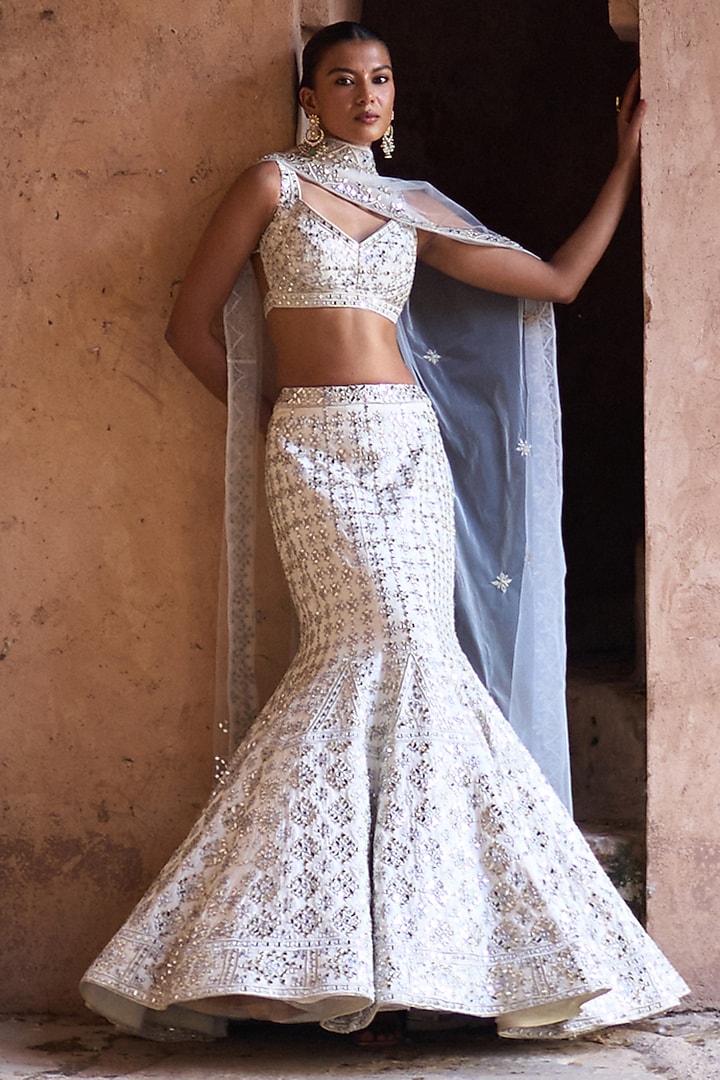 Ivory Raw Silk Mirror Work Bridal Lehenga Set by Angad Singh at Pernia's Pop Up Shop