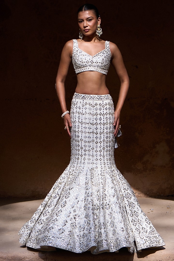 Ivory Raw Silk Mirror Work Bridal Lehenga Set by Angad Singh at Pernia's Pop Up Shop