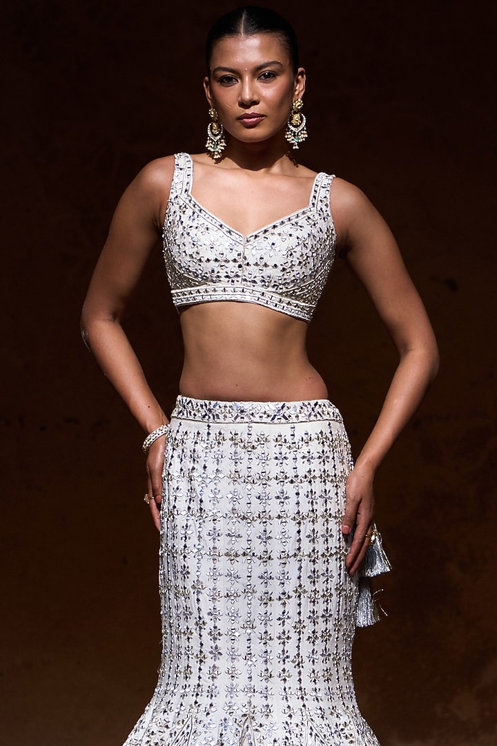 Ivory Raw Silk Mirror Work Bridal Lehenga Set by Angad Singh at Pernia's Pop Up Shop
