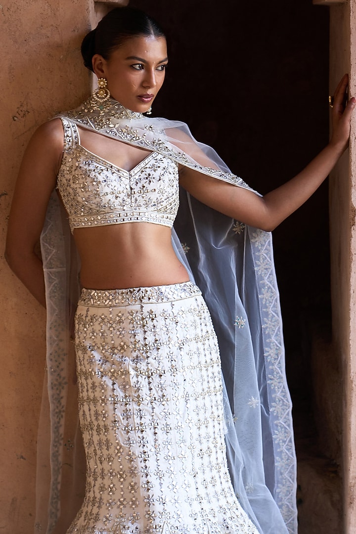 Ivory Raw Silk Mirror Work Bridal Lehenga Set by Angad Singh at Pernia's Pop Up Shop