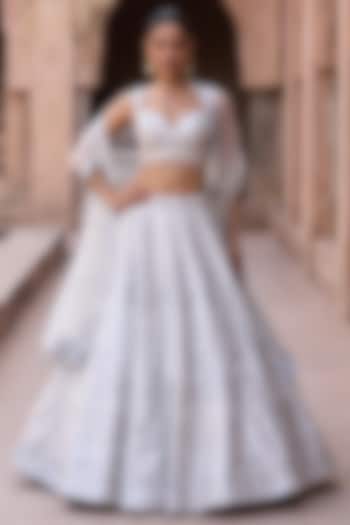 Ivory Raw Silk Mirror Work Bridal Lehenga Set by Angad Singh at Pernia's Pop Up Shop
