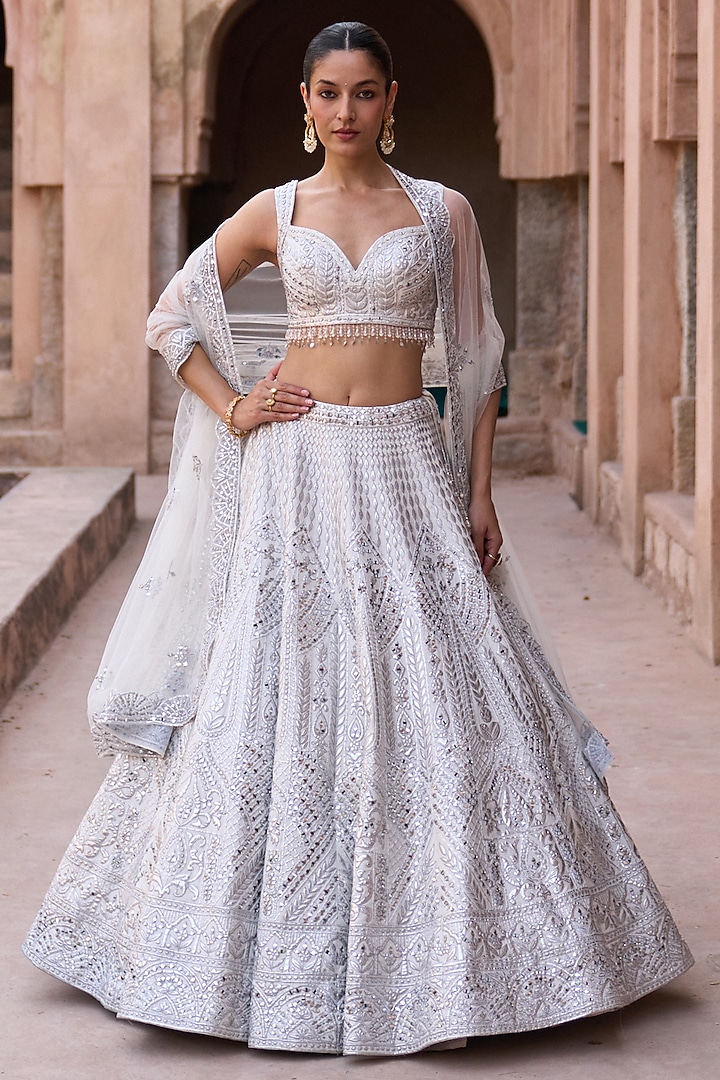 Ivory Raw Silk Mirror Work Bridal Lehenga Set by Angad Singh at Pernia's Pop Up Shop