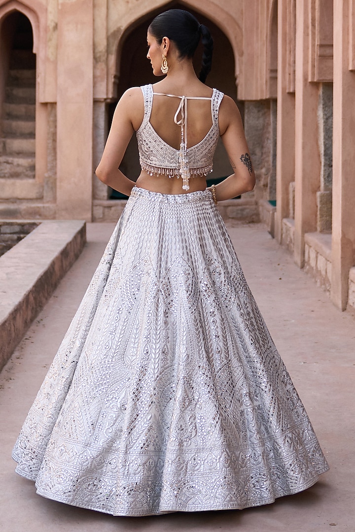 Ivory Raw Silk Mirror Work Bridal Lehenga Set by Angad Singh at Pernia's Pop Up Shop