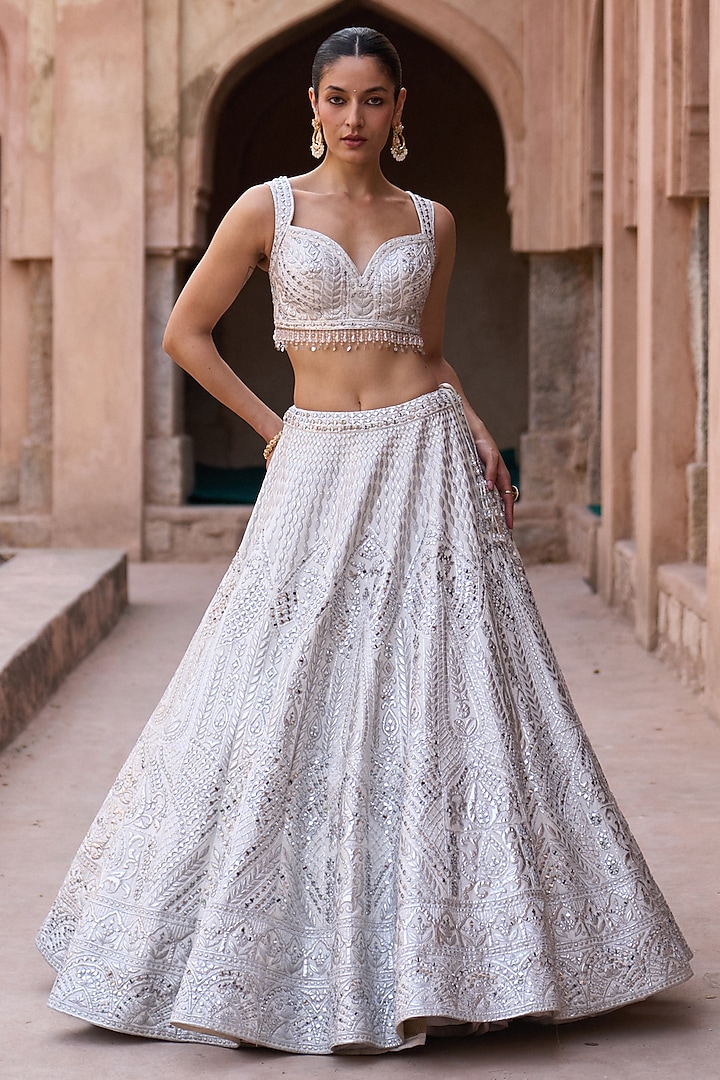 Ivory Raw Silk Mirror Work Bridal Lehenga Set by Angad Singh at Pernia's Pop Up Shop