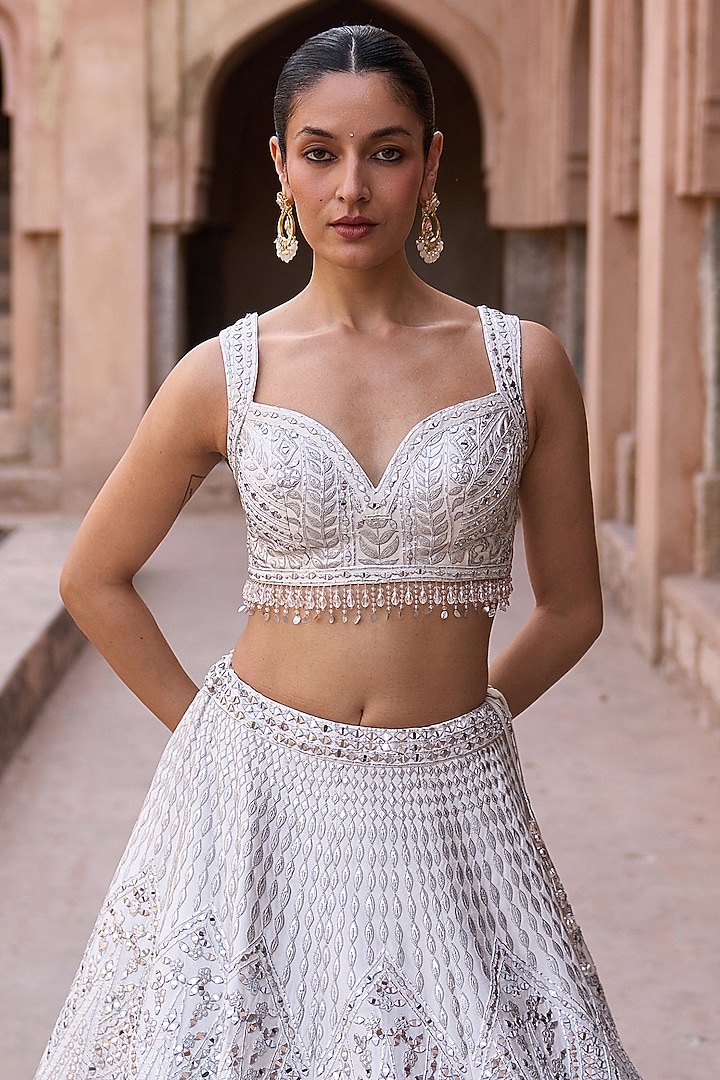 Ivory Raw Silk Mirror Work Bridal Lehenga Set by Angad Singh at Pernia's Pop Up Shop