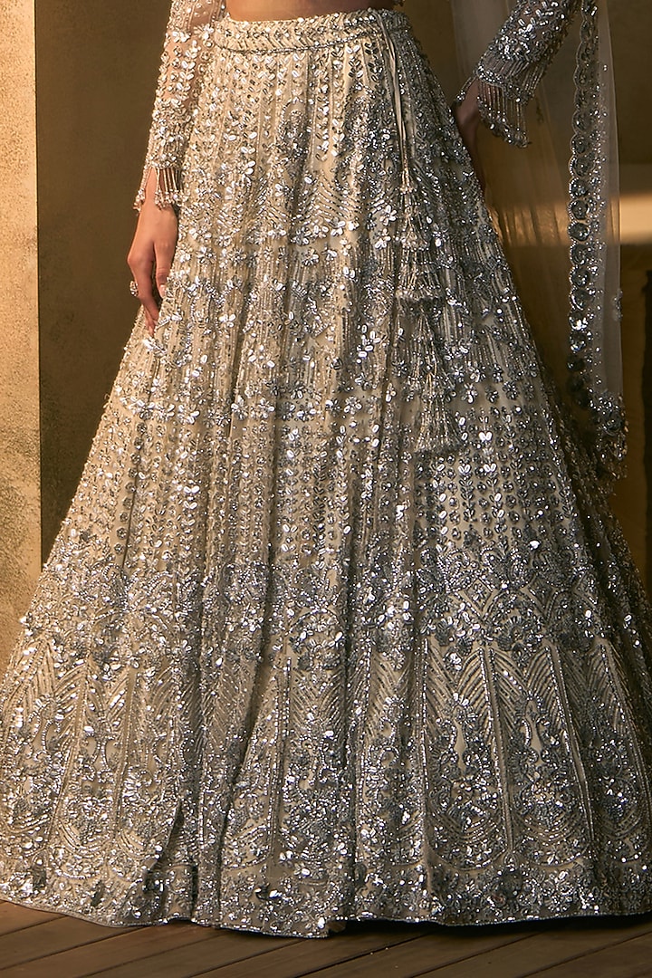 Ivory Net Silver Embroidered Bridal Bridal Lehenga Set by Angad Singh at Pernia's Pop Up Shop