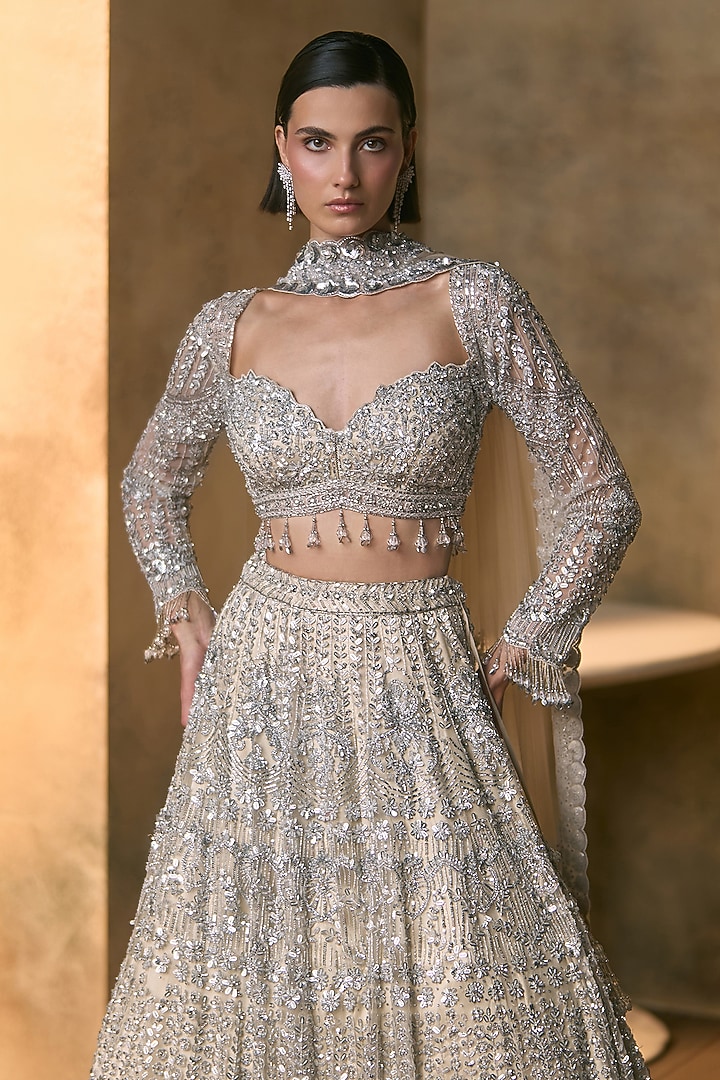 Ivory Net Silver Embroidered Bridal Bridal Lehenga Set by Angad Singh at Pernia's Pop Up Shop