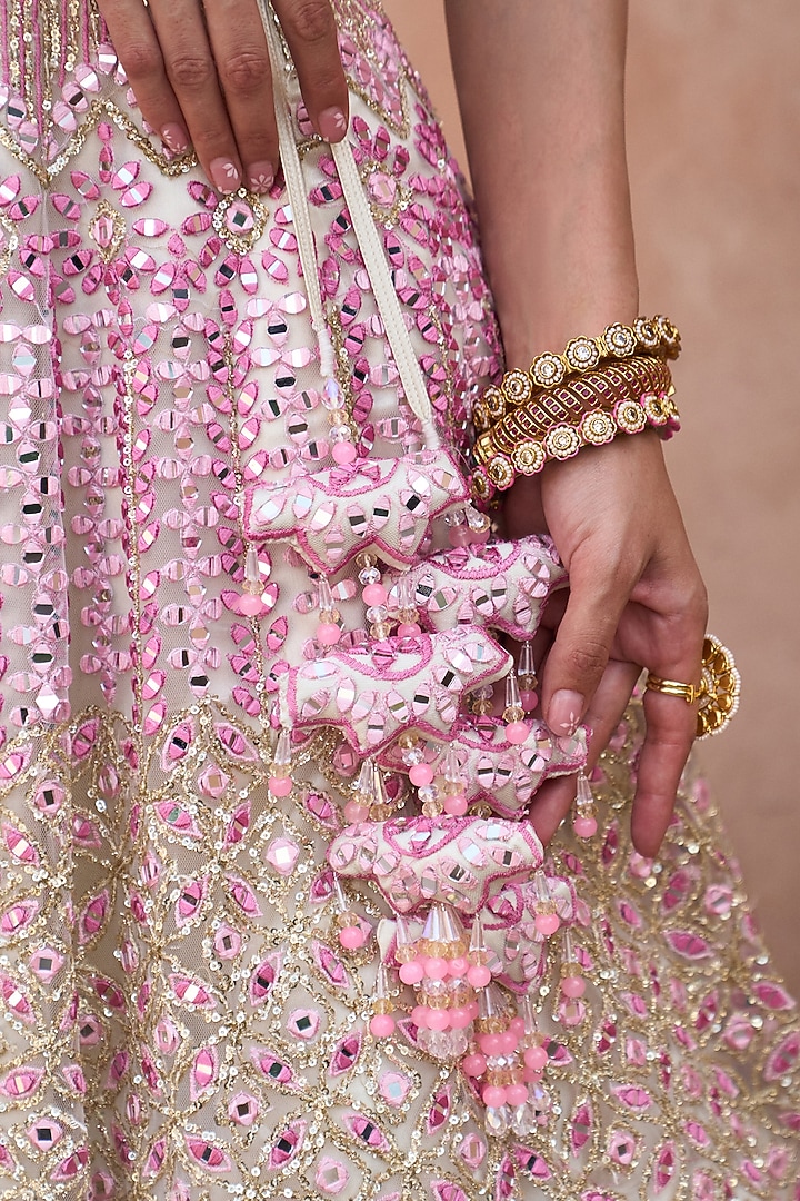 Ivory Net Mirror & Floral Embroidered Bridal Lehenga Set by Angad Singh at Pernia's Pop Up Shop