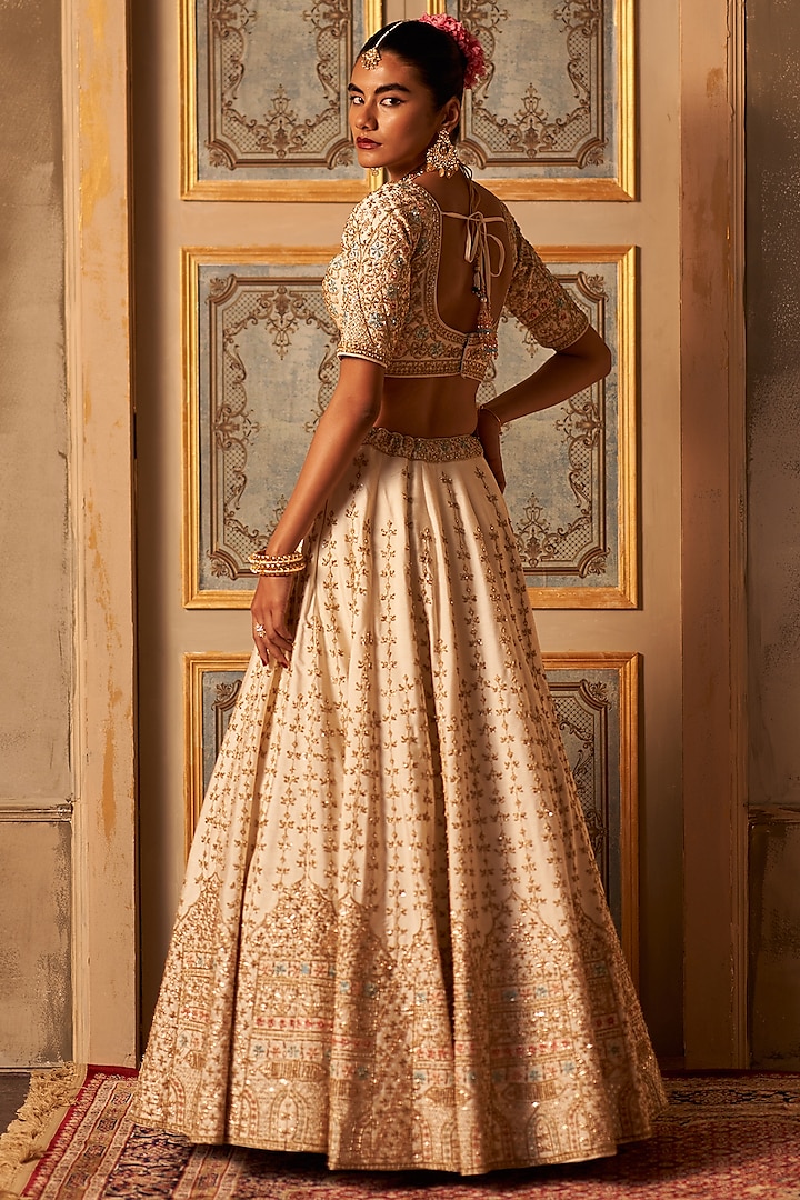 Ivory Raw Silk Embroidered Wedding Lehenga Set by Angad Singh at Pernia's Pop Up Shop