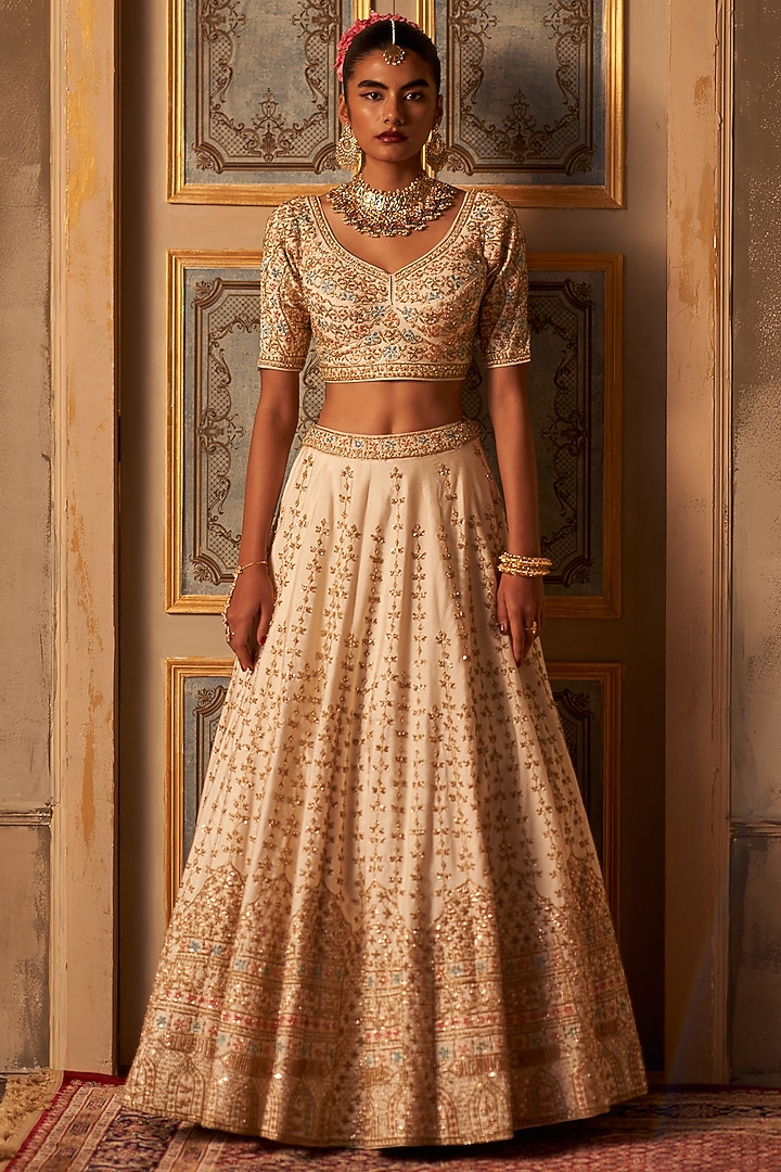 Ivory Raw Silk Embroidered Wedding Lehenga Set by Angad Singh at Pernia's Pop Up Shop