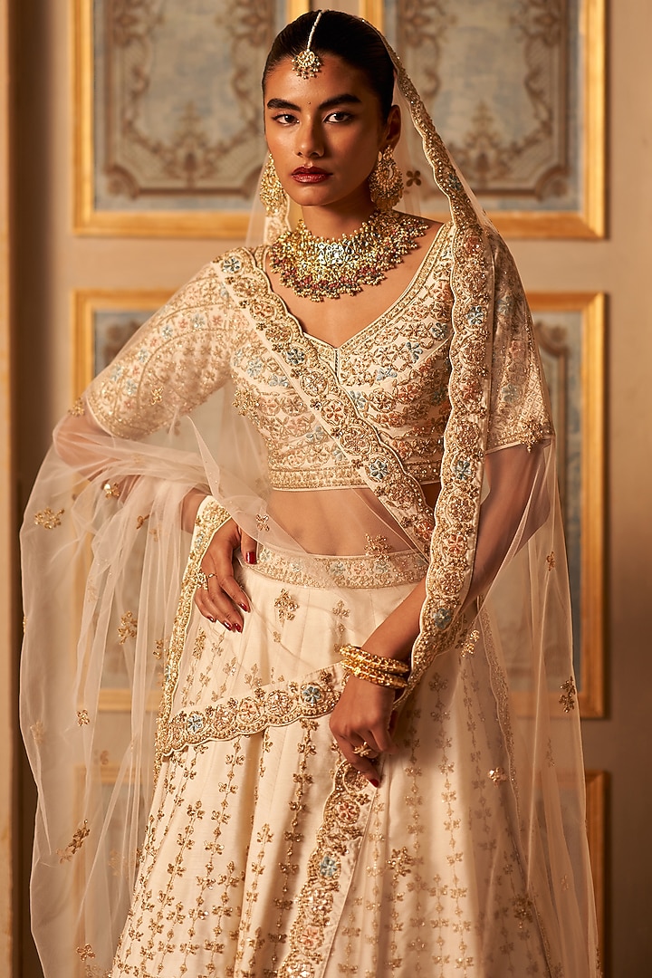 Ivory Raw Silk Embroidered Wedding Lehenga Set by Angad Singh at Pernia's Pop Up Shop