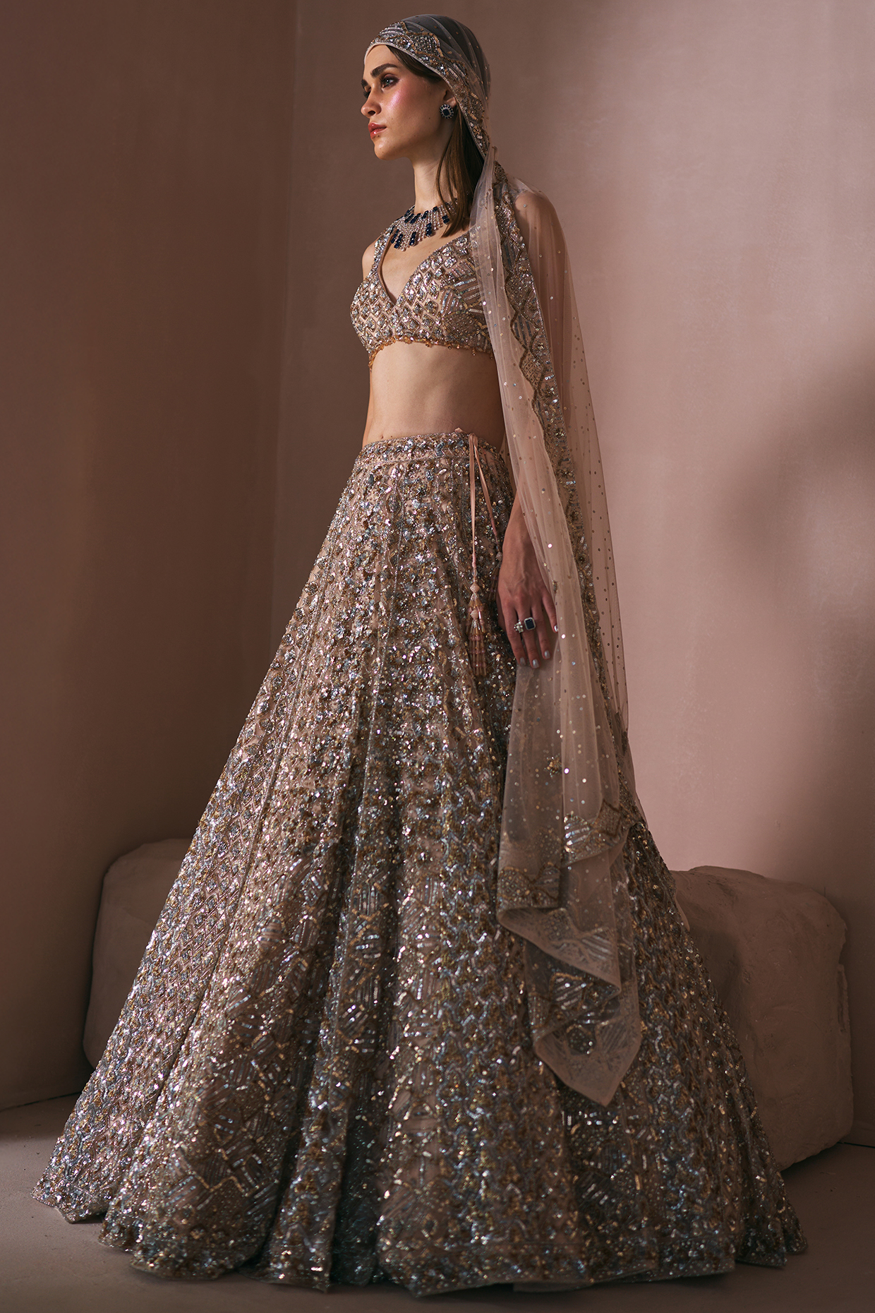 Champagne Gold Net Sequins Embroidered Bridal Lehenga Set by Angad Singh at Pernia's Pop Up Shop